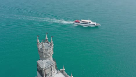 castle and ferry on the water