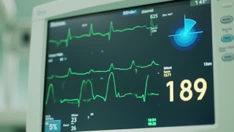 the heart rate monitor displays important vital signs in a clinical environment. numbers indicate heart rate and other physiological metrics, crucial for patient assessment during treatment.
