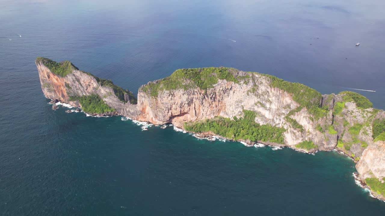 Aerial drone video of the tip of Phi Phi Leh island, Krabi province, Thailand with a majestic view of cliffs.