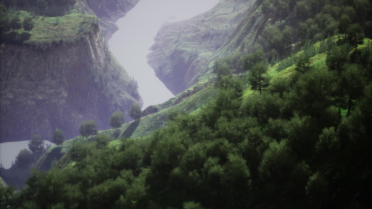 Lush green hills surround winding river in mountainous landscape