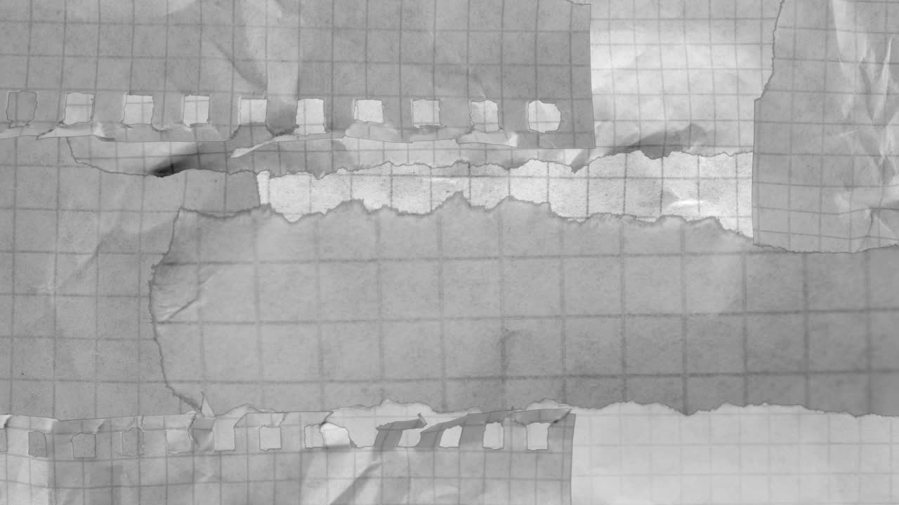 Crumpled Grid Paper Pieces Falling on Black Background