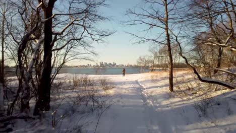 man sanding on white snow in winter, squantum, massachusetts