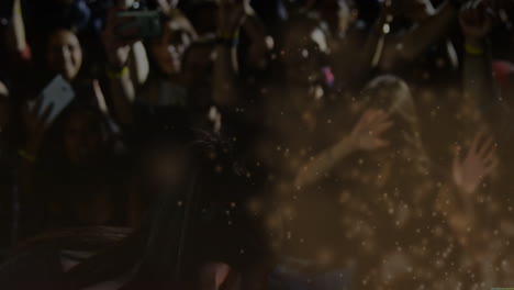 female singer singing into microphone stage left, overlaying music spark icons onto audience phones