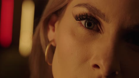 young woman with beautiful bob and make up looks into the camera close up