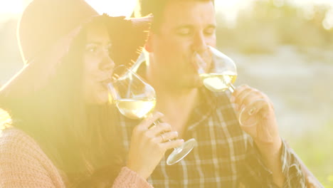 close up shot of couple in sun flares having a tender moment