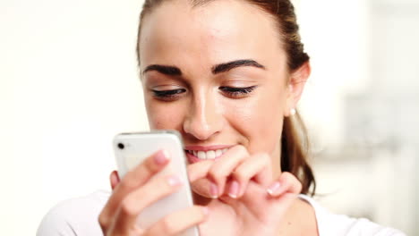 Pretty-woman-taking-photo-of-herself-with-mobile-phone-camera