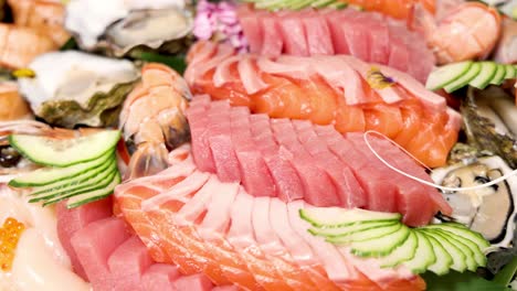 a colorful display of assorted sushi and sashimi