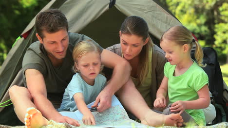 cute family camping in the countryside