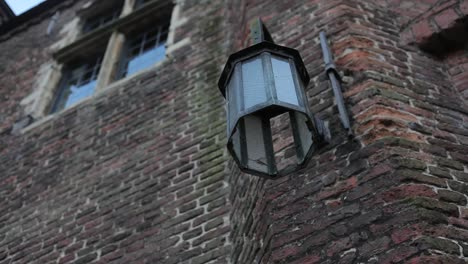 Lamp-hanging-on-castle-wall