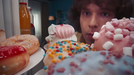 teenager looking at delicious treats in refrigerator