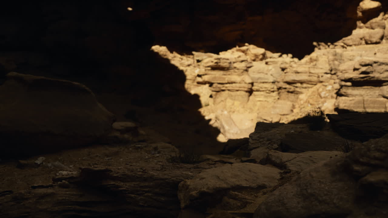 Exploring a rocky canyon with natural light illuminating the formations