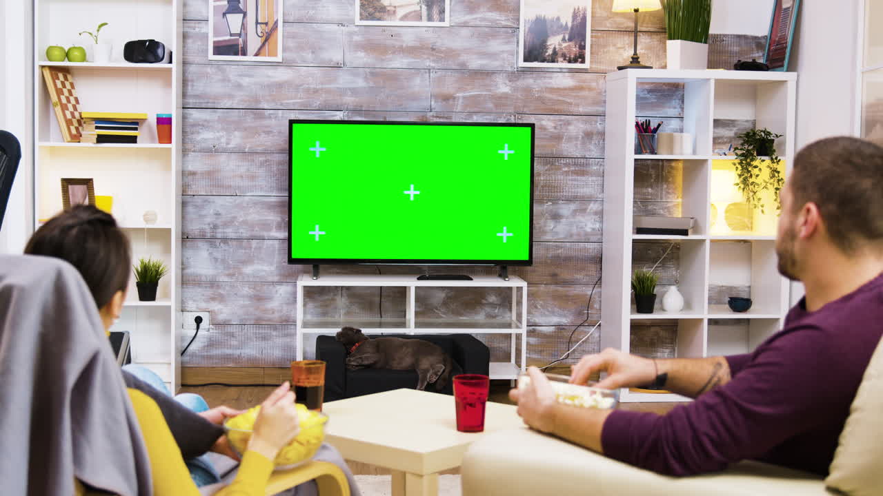 Couple Watching TV with Green Screen