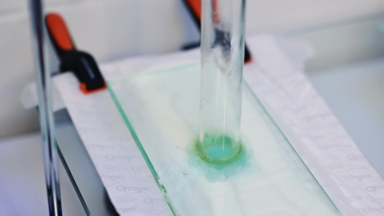 Production of diapers laboratory. Testing the absorbing abilities of diaper layers at the enterprise. Close up.