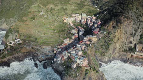 Aerial-view-of-Manarola,-Cinque-Terre,-during-a-sea-storm