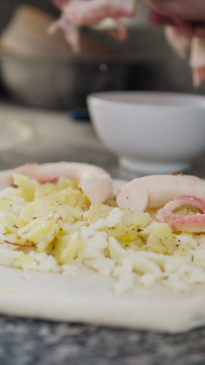 Professional Chef Preparing A Pizza With Octopus In The Restaurant Kitchen