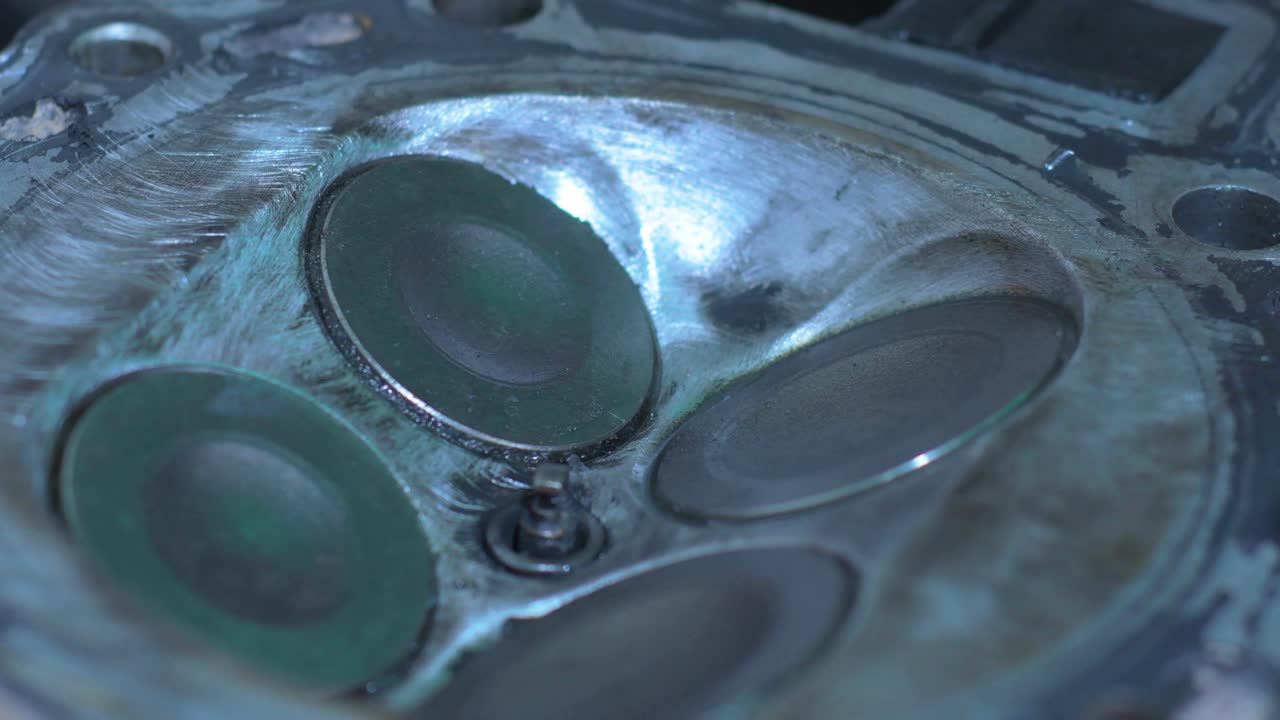 Detailed close-up of valves rotating and opening in a KLR motorcycle engine. This footage highlights the intricate mechanics involved in the maintenance process, showcasing precision and care