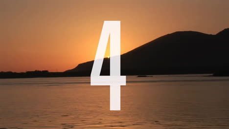 number 5 animation over sunset landscape with mountains and water