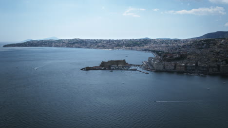 slow aerial hyperlapse rotation around castel dell'ovo in naples, italy