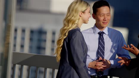 multi ethnic management team meeting on chicago rooftop