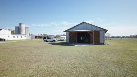 Corrugated-iron-construction-barn-on-farmland-gimbal-shot