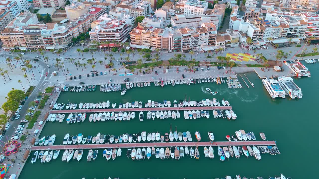 Luxury yachts docked, Port d’Alcudia marina, golden hour, aerial reveal