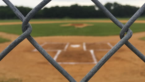 Baseball-field-defocused-behind-fence