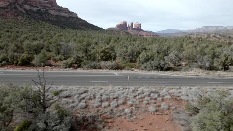 Red-rock-mountains-and-buttes-in-Sedona,-Arizona-with-drone-video-moving-sideways-close-up