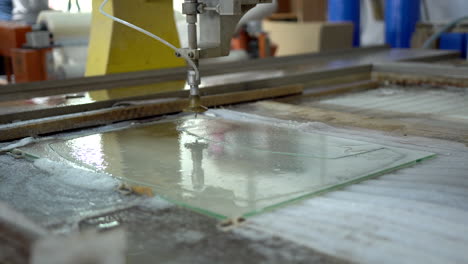 cleaning the finished final product made from a glass panel with cnc water jet cutter