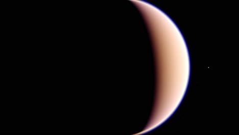 titán, girando alrededor de esta luna en la oscuridad del espacio exterior