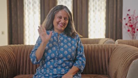 indian old woman waving hello