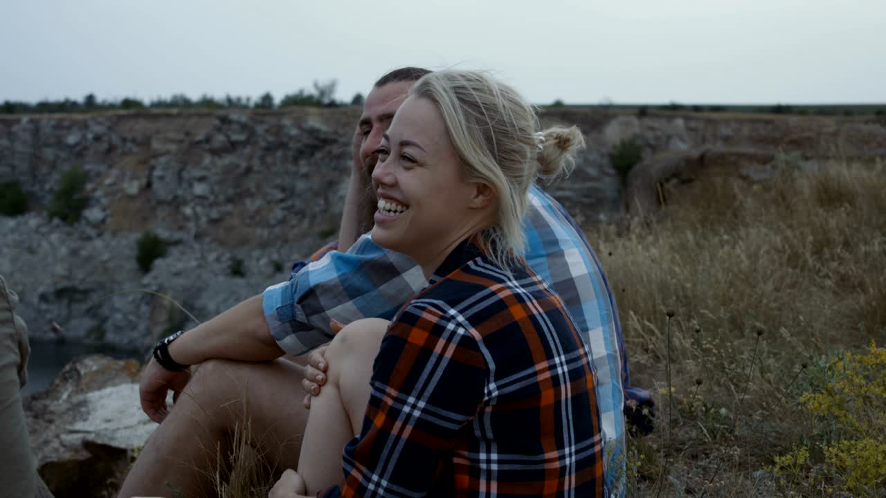 Relaxing young people taking rest in nature