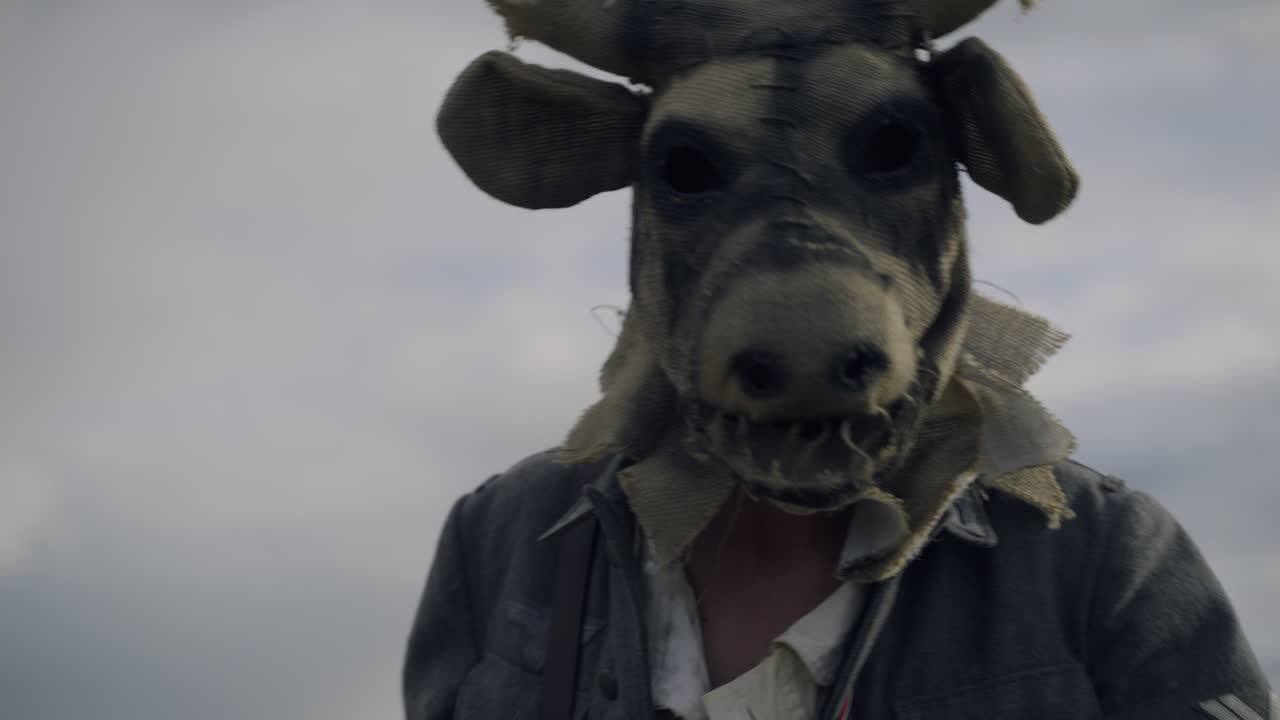 Person Wearing a Scary Cow Mask