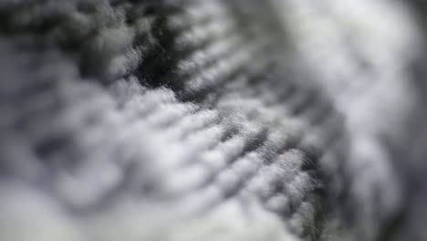 macro shot of recycled textiles being manufactured on a recycle spinning machine