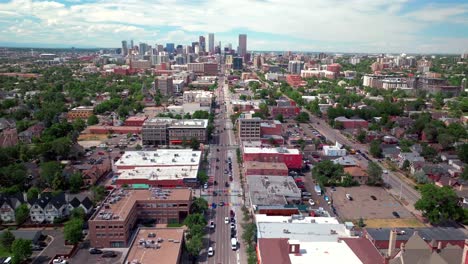 Rainbow-cross-walk-Downtown-Denver-Colorado-South-Broadway-street-aerial-drone-view-landscape-businesses-restaurants-traffic-cars-pedestrian-traffic-bike-crossing-road-summer-sunny-afternoon-down-jib