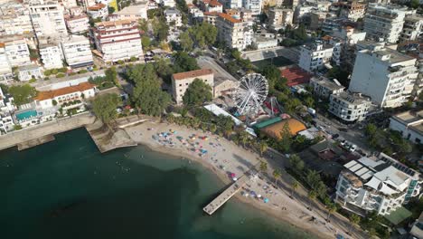 aerial view of beach, ferris wheel in downtown saranda , albanian riviera