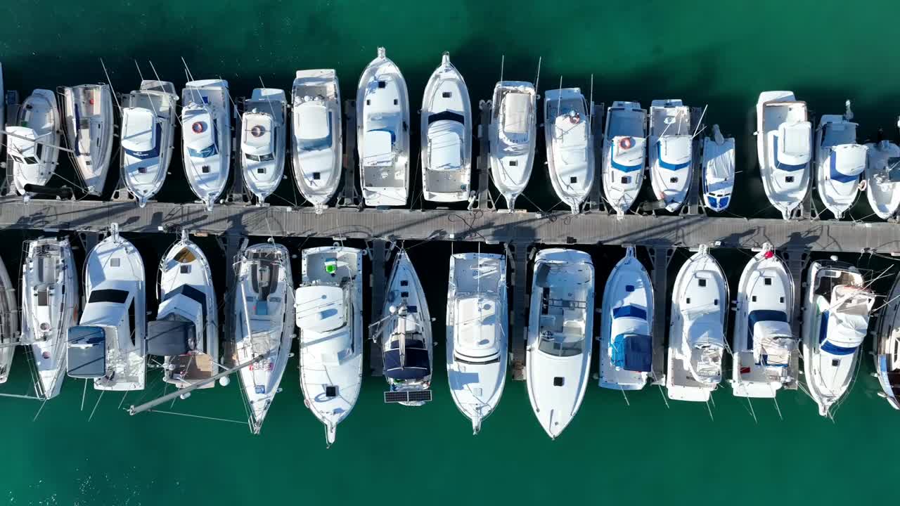 Sailing boats in small harbour in Greece
