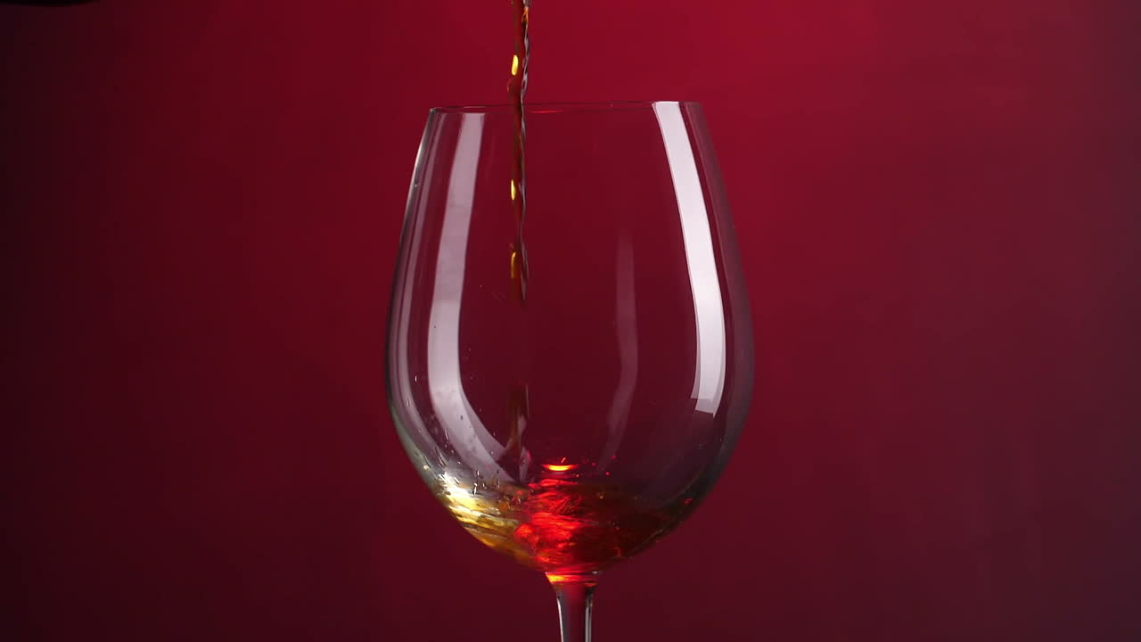 Wine Is Pouring Into A Wine Glass, Slow Motion