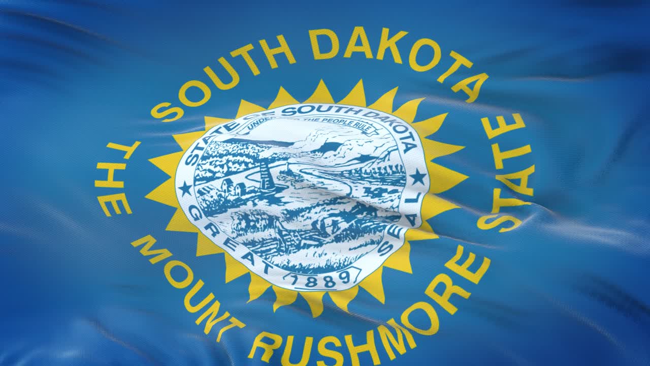 la bandera de dakota del sur (estado de los estados unidos) ondeando en el viento con una textura de tela muy detallada. bucle sin costuras