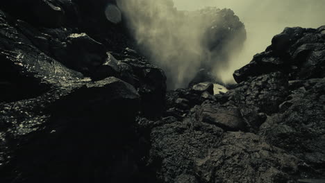 powerful ocean waves crashing against volcanic rocks