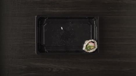 sushi in a takeout container