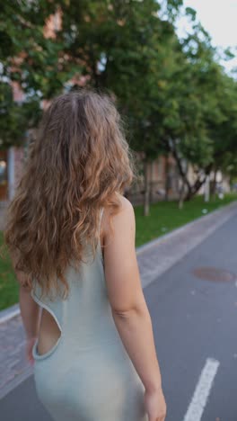 woman walking down city street