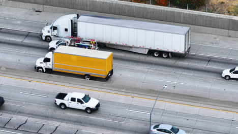 4k aerial video of trucks on the highway in california