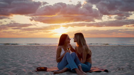 joyful moments with wine on the beach at sunset