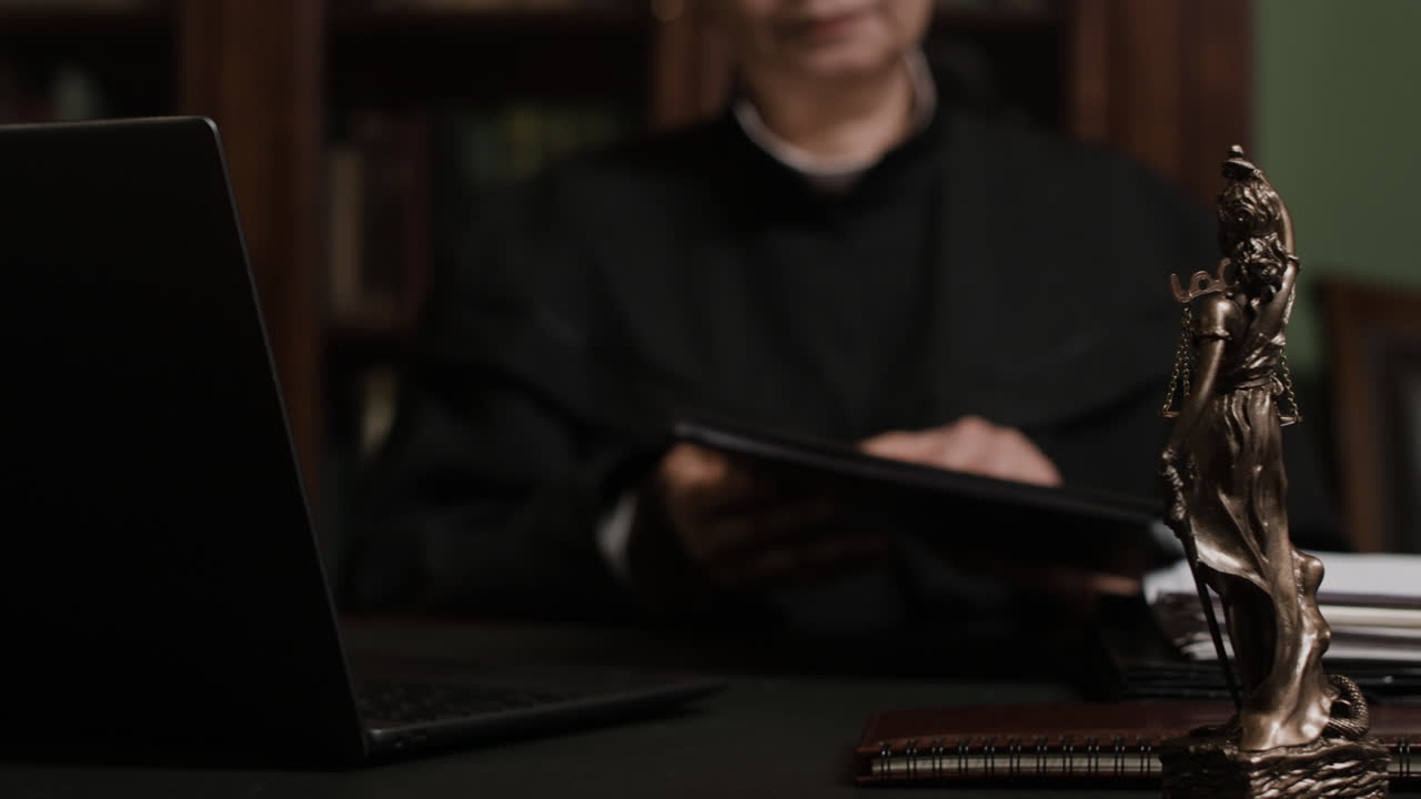 Judge Reviewing Documents in Courtroom