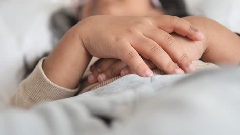 close up of a woman sleeping in bed