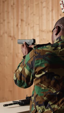 vertical video military unit in firing range cheering after hitting bullseye