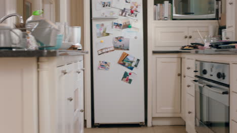 happy little girl dancing in kitchen having fun doing funny dance moves enjoying weekend at home