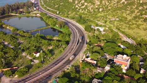 Main-coastal-highway-road-Ah-1-in-Vietnam-leading-through-rural-green-vibrant-landscape