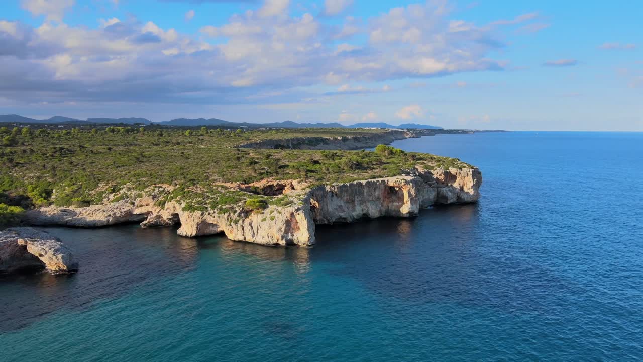 Discover the breathtaking cliffs and crystal-clear waters of Cala Varques in Porto Cristo, Majorca. Experience the beauty of nature and tranquility in this serene coastal location.
