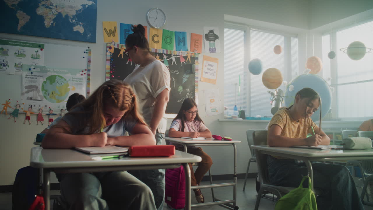 Concentrated Primary School Children Writing School Test in Modern Classroom